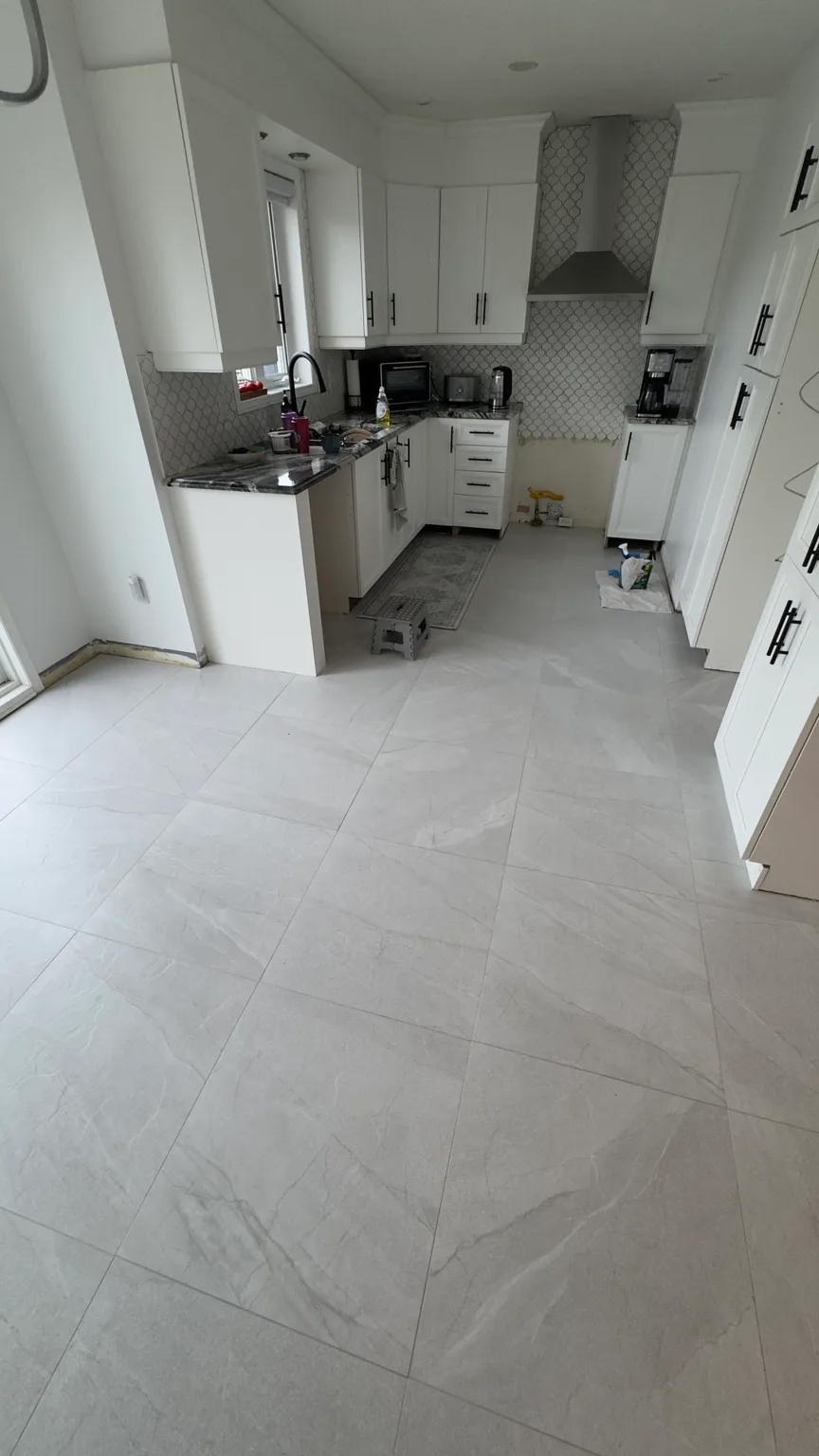 Detail of the porcelain kitchen floor and epoxy grout.
