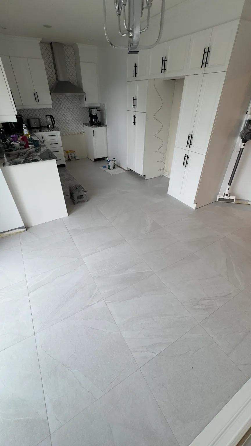 Overall view of the new porcelain kitchen floor after completion.