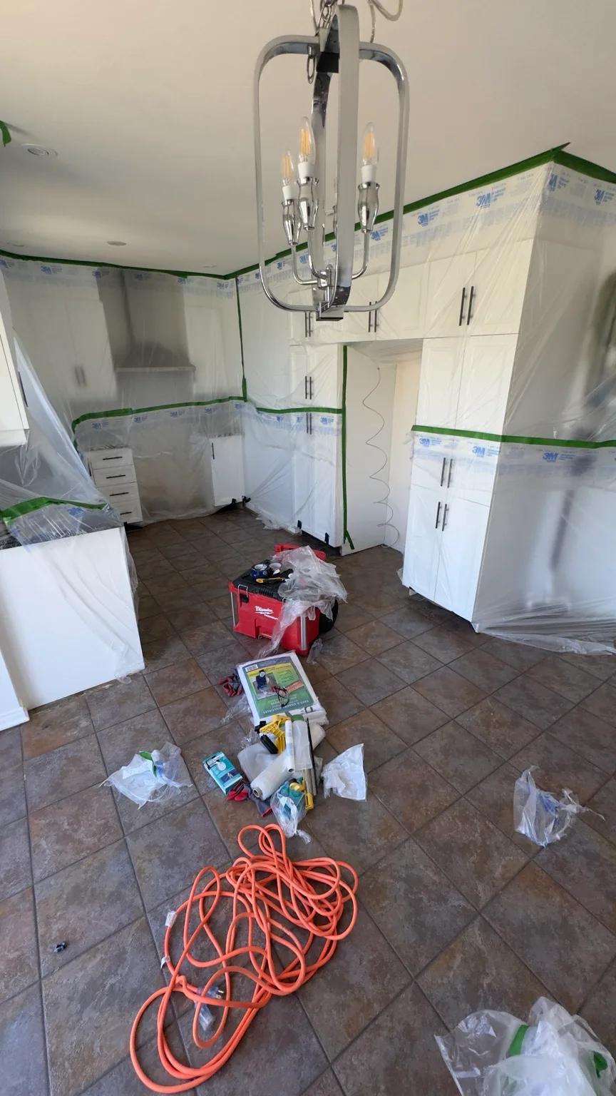 Dust-control containment installed to limit spread through the residence.