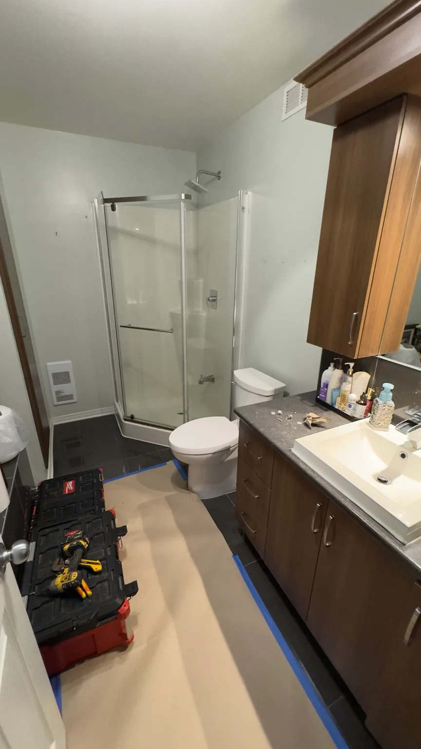 General bathroom view before the prefabricated shower was replaced.